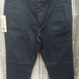 Slightly below waistRoomier through the seat and thigh; Straight leg opening